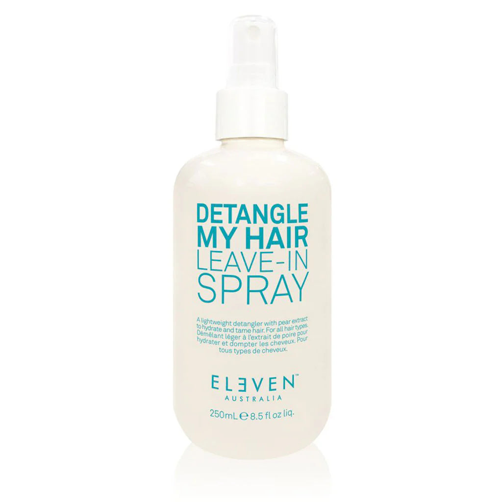 A bottle of Detangle My Hair detangling spray with a white spray nozzle and a label that reads 'Detangle My Hair Leave-In Spray ELEVEN'.